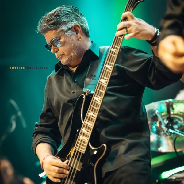 Riffster Gallery - Performance bass player on green background