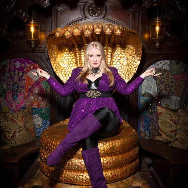 Riffster - portrait photography female sitting in gold chair pose