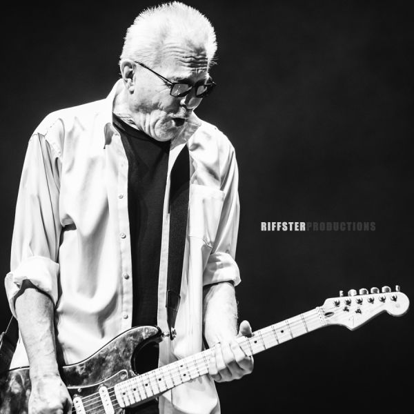 Riffster Gallery - Performance guitar player on black background